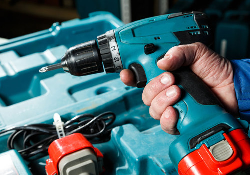 Man Holding A Cordless Power Drill