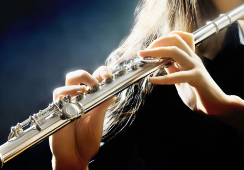 Blond Woman Playing A Flute