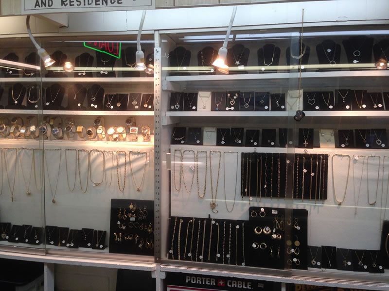 Display Case With Gold Jewelry And Necklaces