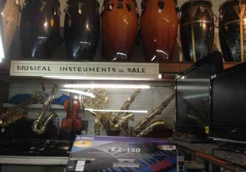 Display Case With Bongos, Horns, Keyboards, And Other Musical Instruments